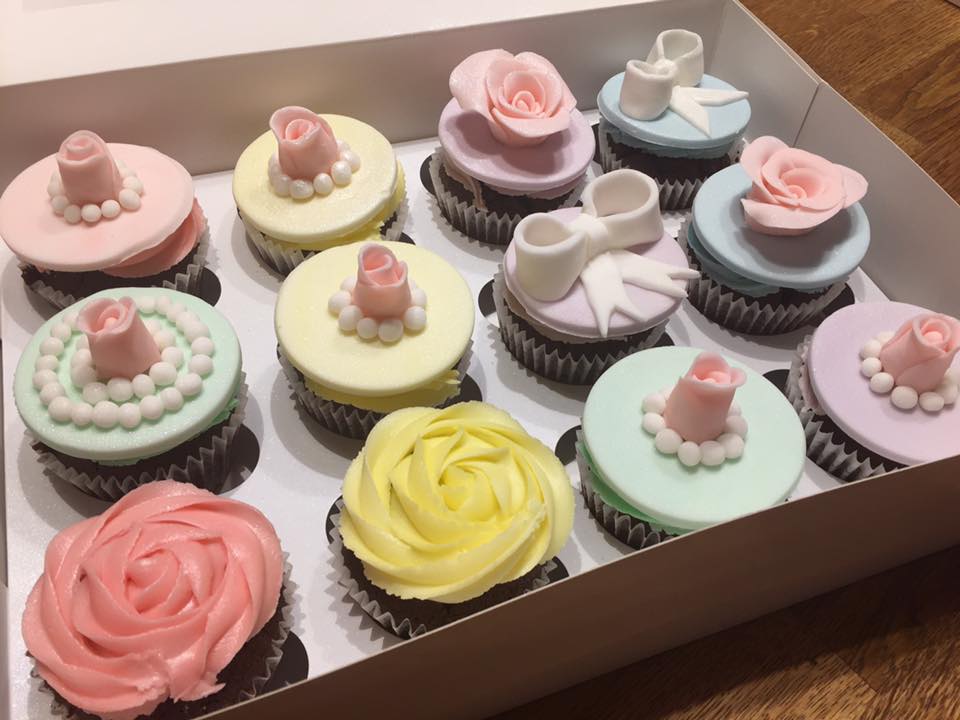 cupcakes with fondant roses on top 