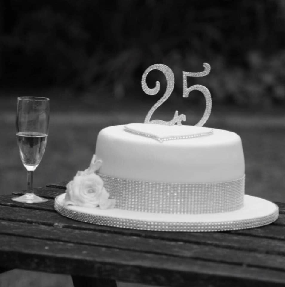 black and white picture of a 25th wedding anniversary cake 