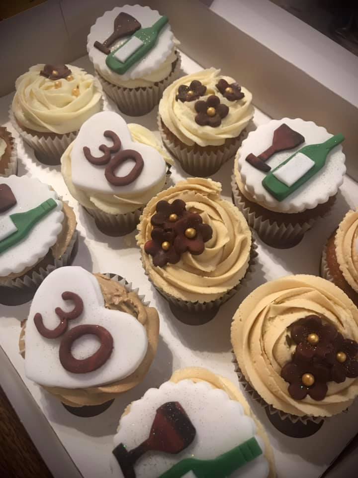 cupcakes with fondant hearts with number 30 on and fondant flowers 
