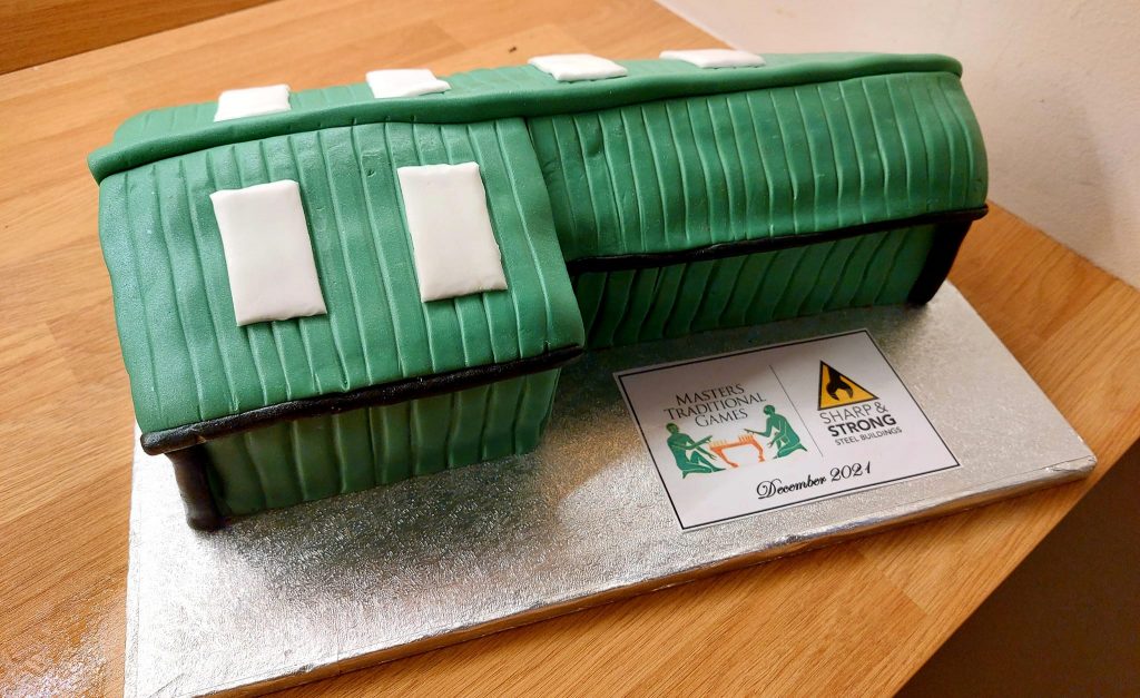 a cake in the shape of a steel building