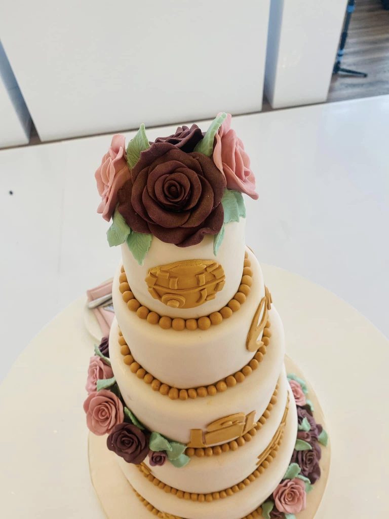 top of 5 tier cake with fondant roses