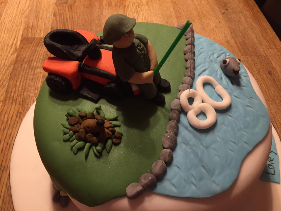 Round cake covered in fondant with a fondant man sitting on his lawn mower by creative cakes by kaz 