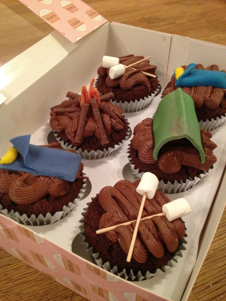 cupcakes with fondant camping items on top 