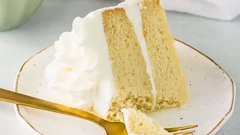 a slice of vanilla sponge cake with buttercream frosting  pricing
